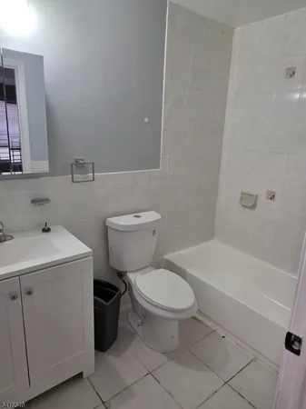 a bathroom with a sink toilet and bathtub
