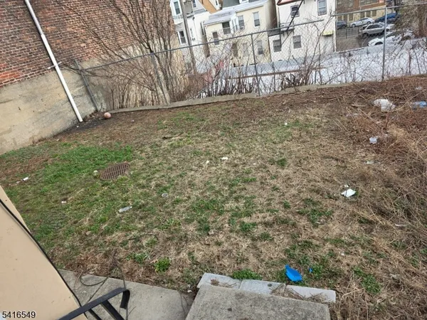 a view of a backyard of the house