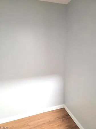 a view of a small space with wooden floor