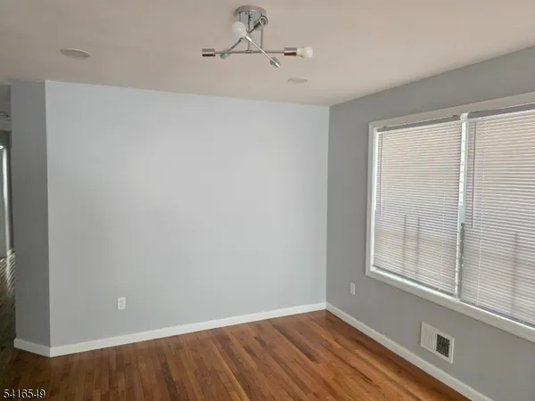 a view of a room that has a window in it