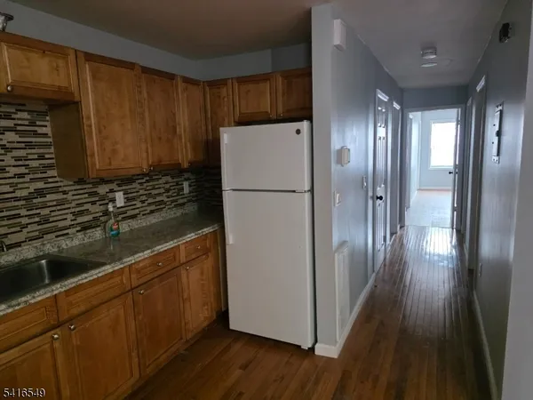 a white refrigerator freezer sitting inside of a kitchen