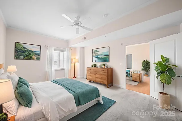 a bedroom with a balcony a bed and a couch