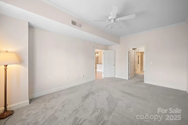 a bathroom with a shower and a glass door