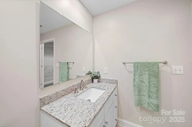 a bathroom with a shower and a glass door