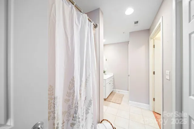 a bathroom with a sink toilet vanity and a mirror