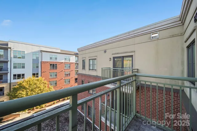 a view of a swimming pool with outdoor seating