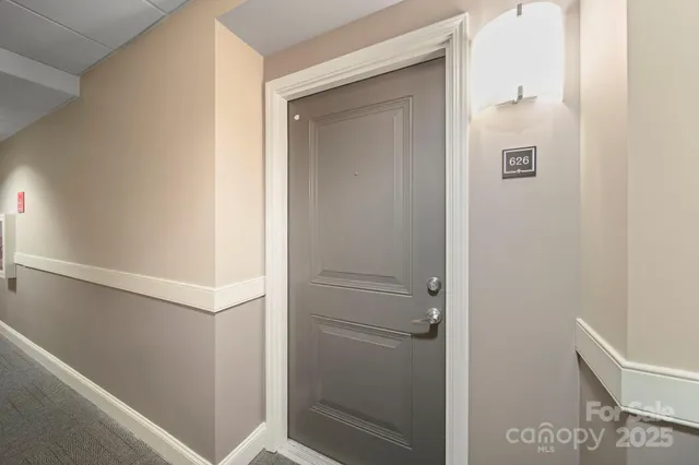 an aerial view of a house with swimming pool patio and outdoor seating