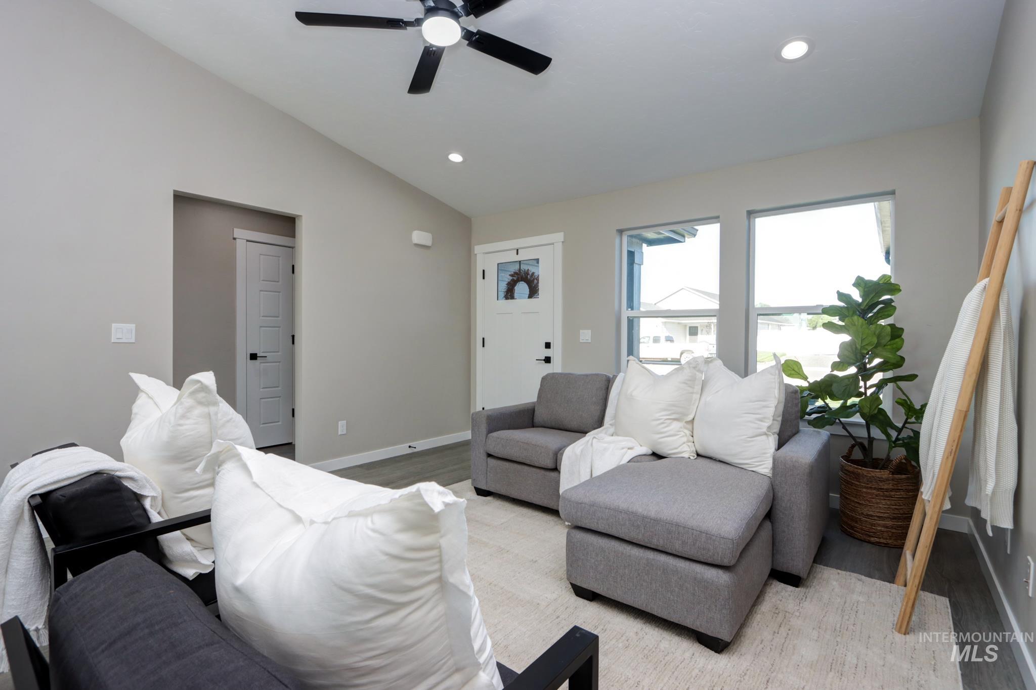 848 North 5th Street Nyssa, OR 97913 - Photo 8 of 49 Vaulted ceiling with a black ceiling fan and recessed lighting