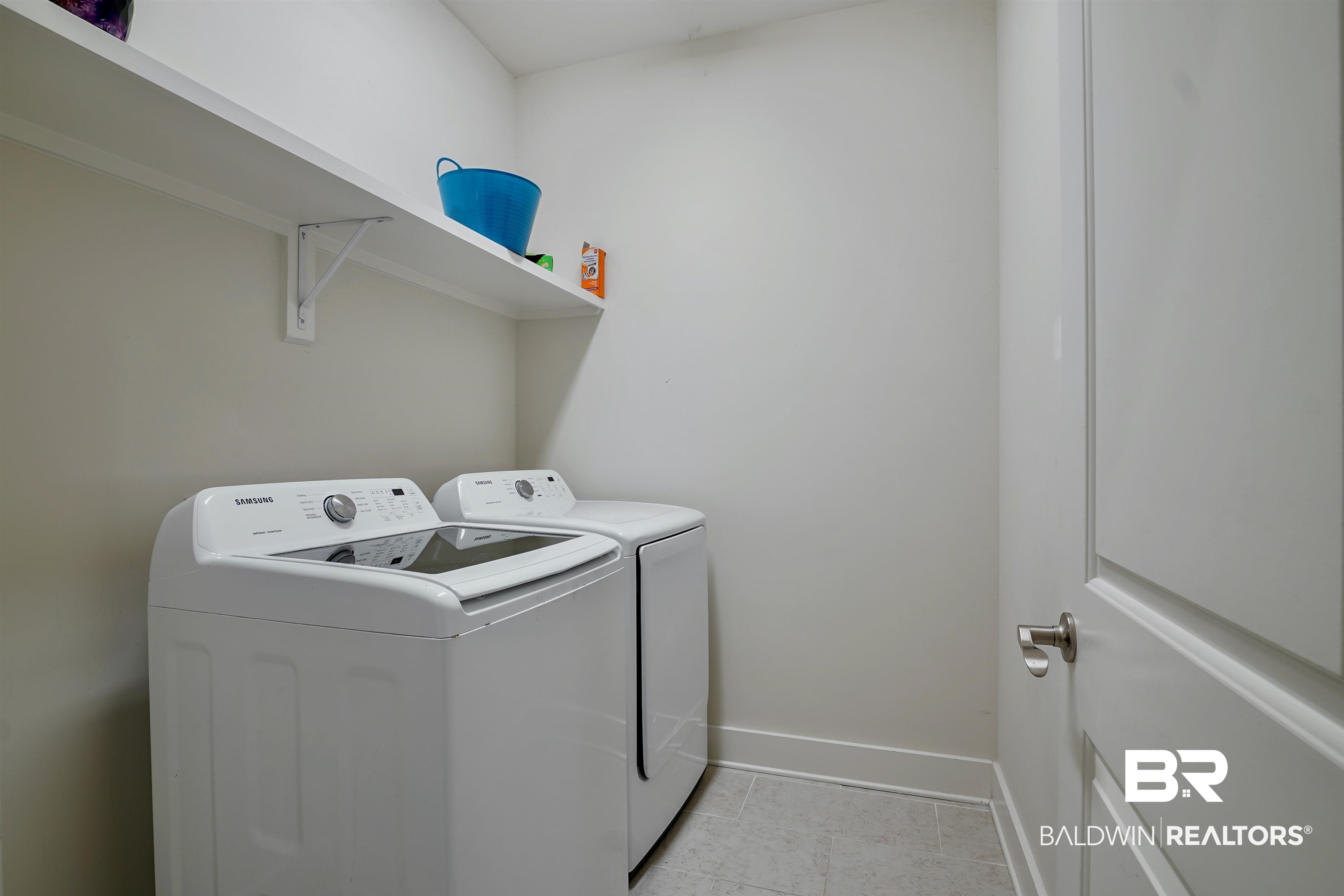 7090 Rocky Rd Loop Gulf Shores, AL 36542 - Photo 24 of 34 Clothes washing area featuring baseboards, laundry area, and washer and clothes dryer