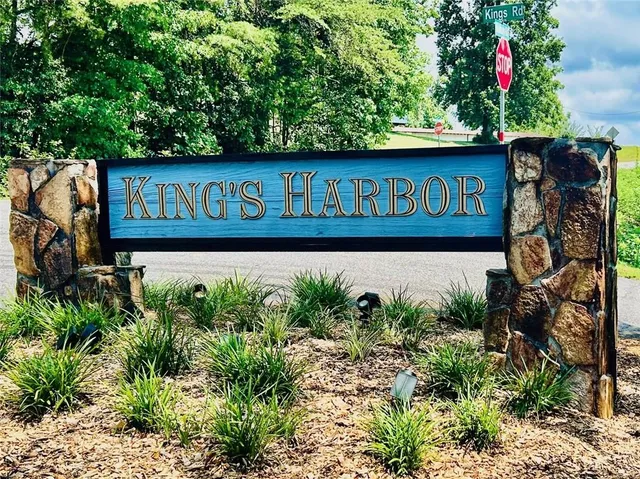 a street sign on a pole on a wall