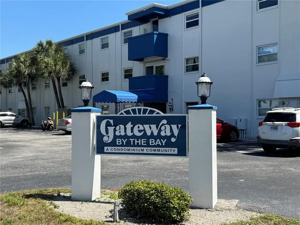 a front view of a building with sign board
