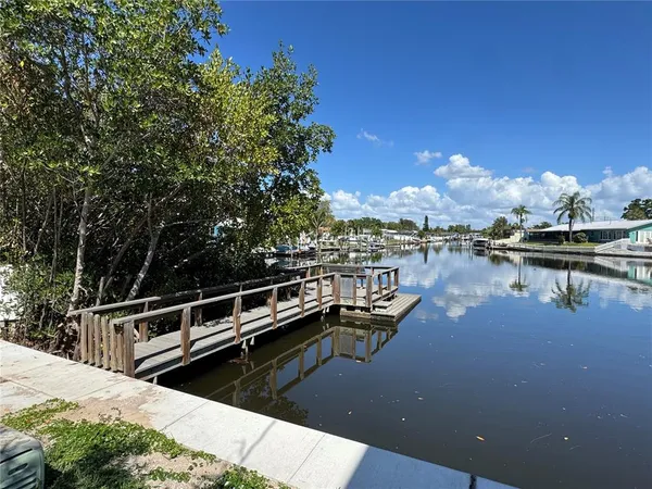 a view of a lake with house next to a lake
