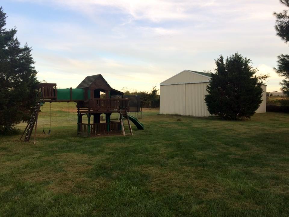 245 South Leath Road Portland, TN 37148 - Photo 19 of 19 a backyard of a house with table and chairs