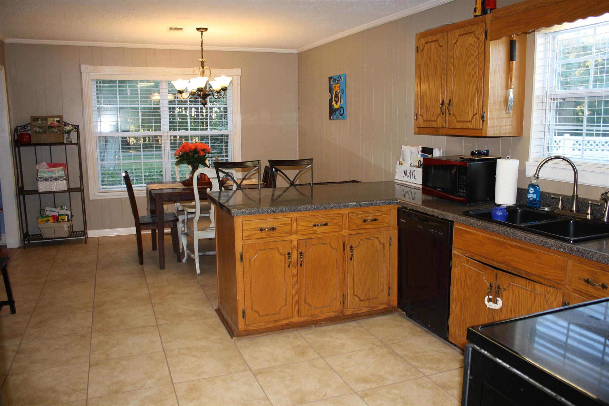 245 South Leath Road Portland, TN 37148 - Photo 4 of 19 a kitchen with stainless steel appliances granite countertop a sink counter space and cabinets