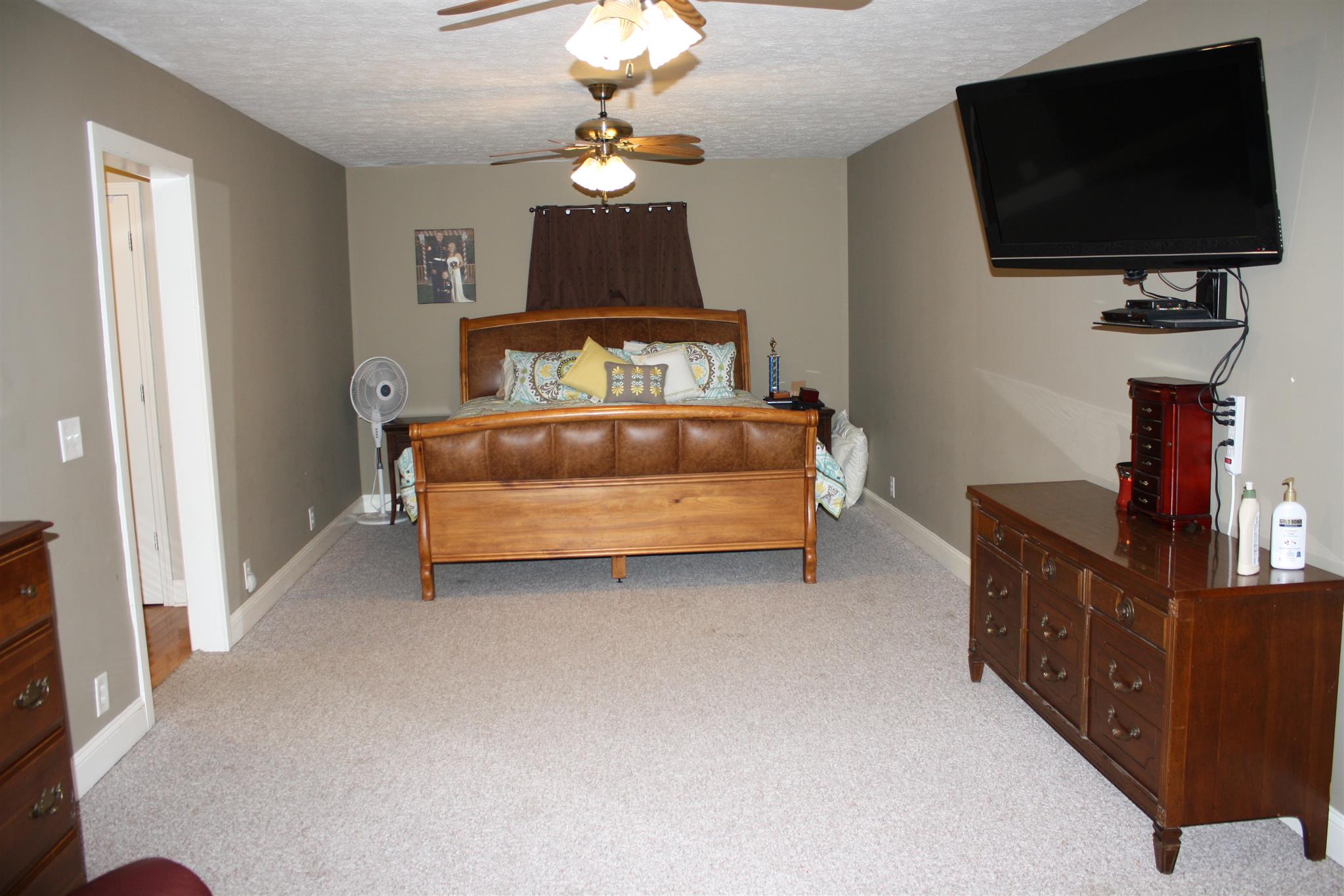 245 South Leath Road Portland, TN 37148 - Photo 6 of 19 a bedroom with a bed and flat screen tv