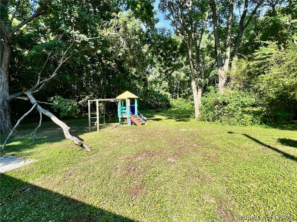 1642 Regent Road Topping, VA 23169 - Photo 3 of 10 View of yard featuring a playground