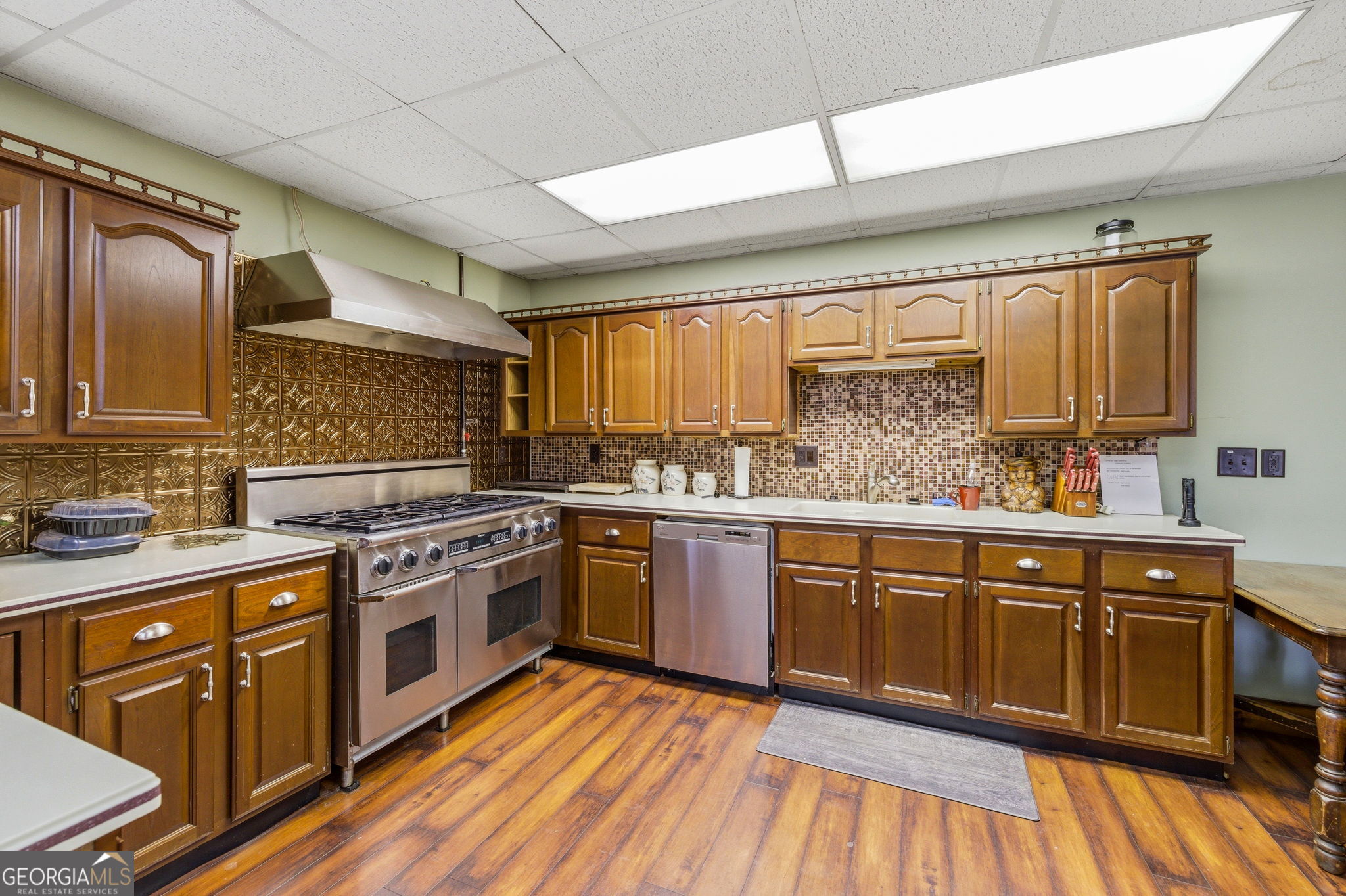 401 Herrin Road Cornelia, GA 30531 - Photo 60 of 83 a kitchen with stainless steel appliances granite countertop wooden cabinets sink and stove