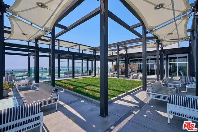 a view of a swimming pool and lounge chair