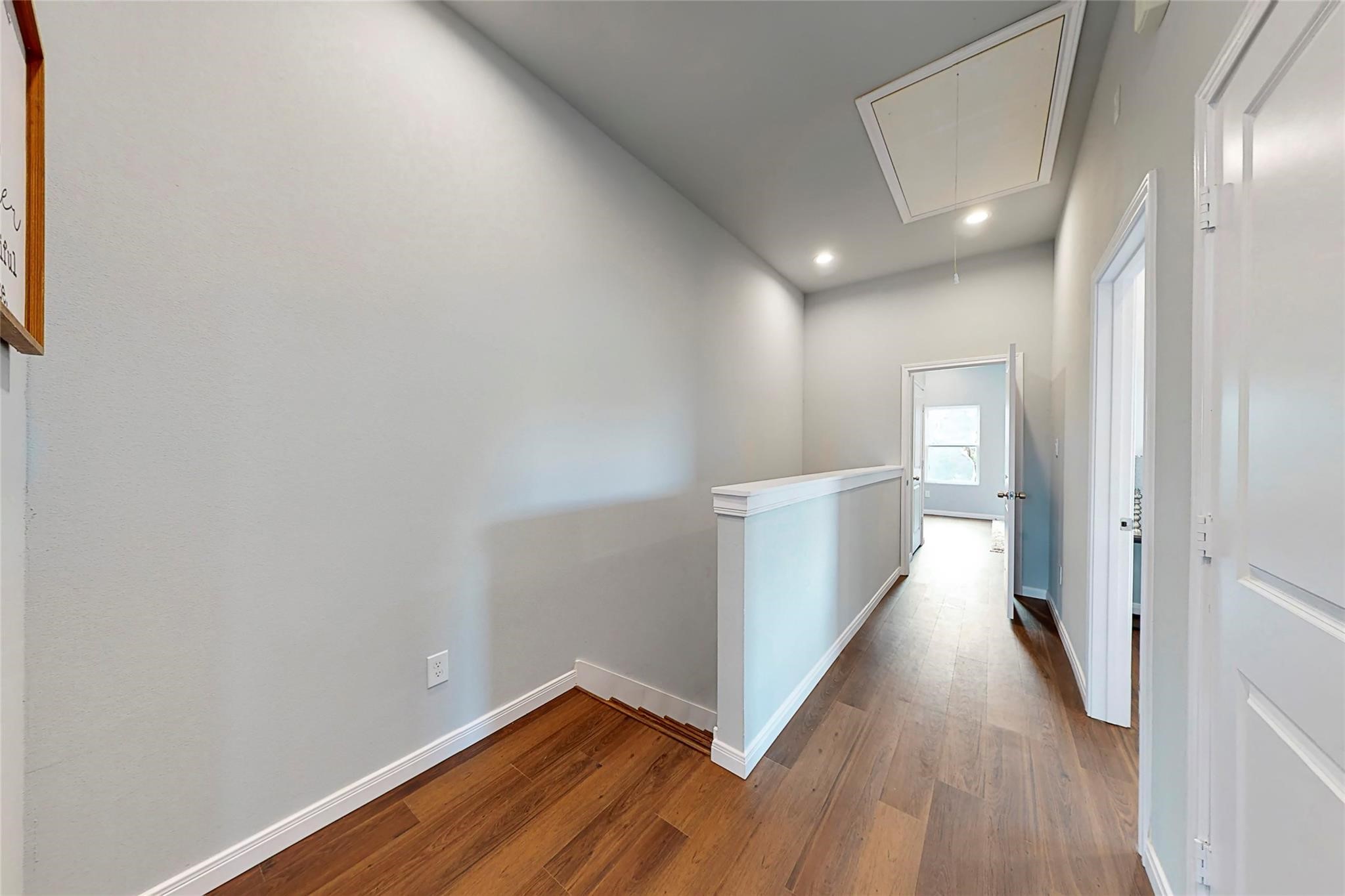 18813 Luminescent Lane Spring, TX 77379 - Photo 10 of 19 a view of a hallway with wooden floor