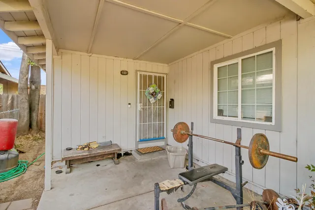 a living room with furniture fireplace and a large window