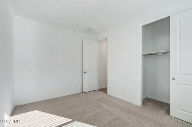 a bathroom with a shower and a glass door