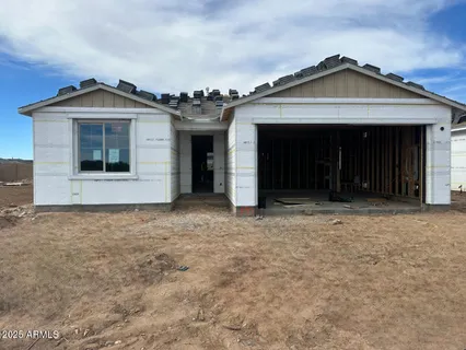 a view of a wooden house with a large window