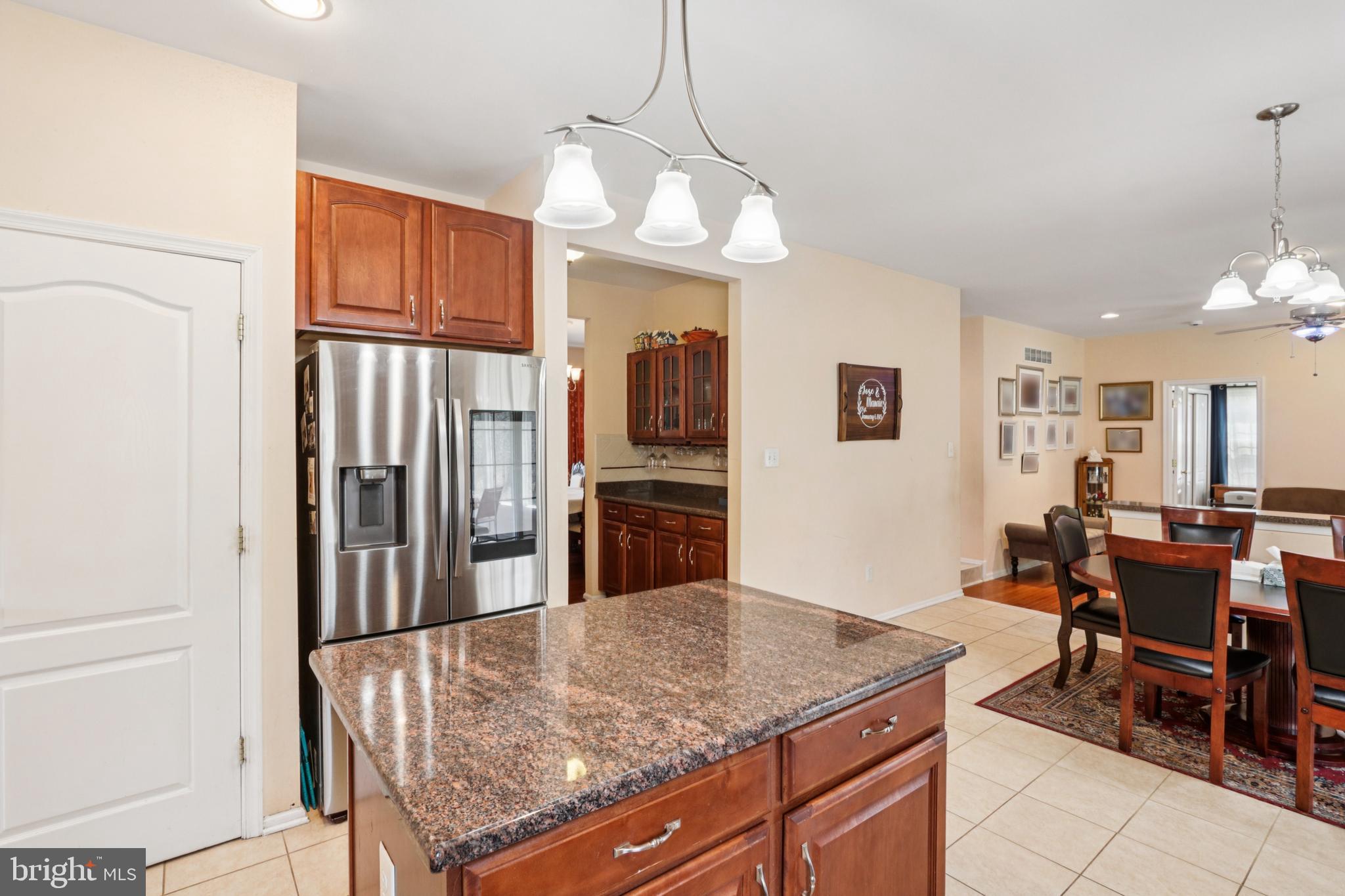 104 Ryans Run Sicklerville, NJ 08081 - Photo 21 of 94 a kitchen with stainless steel appliances granite countertop a refrigerator a oven a sink dishwasher and white cabinets with wooden floor