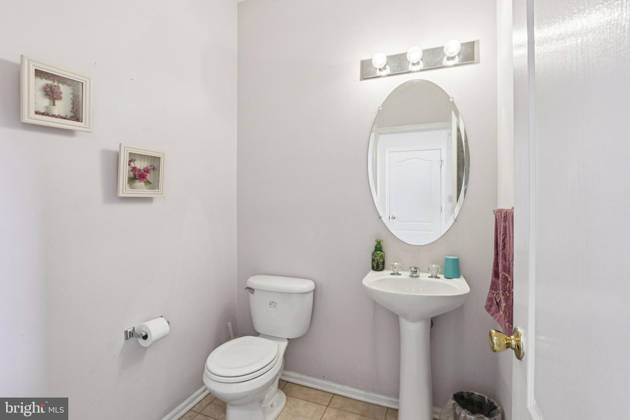 104 Ryans Run Sicklerville, NJ 08081 - Photo 28 of 94 a bathroom with a sink toilet and a mirror