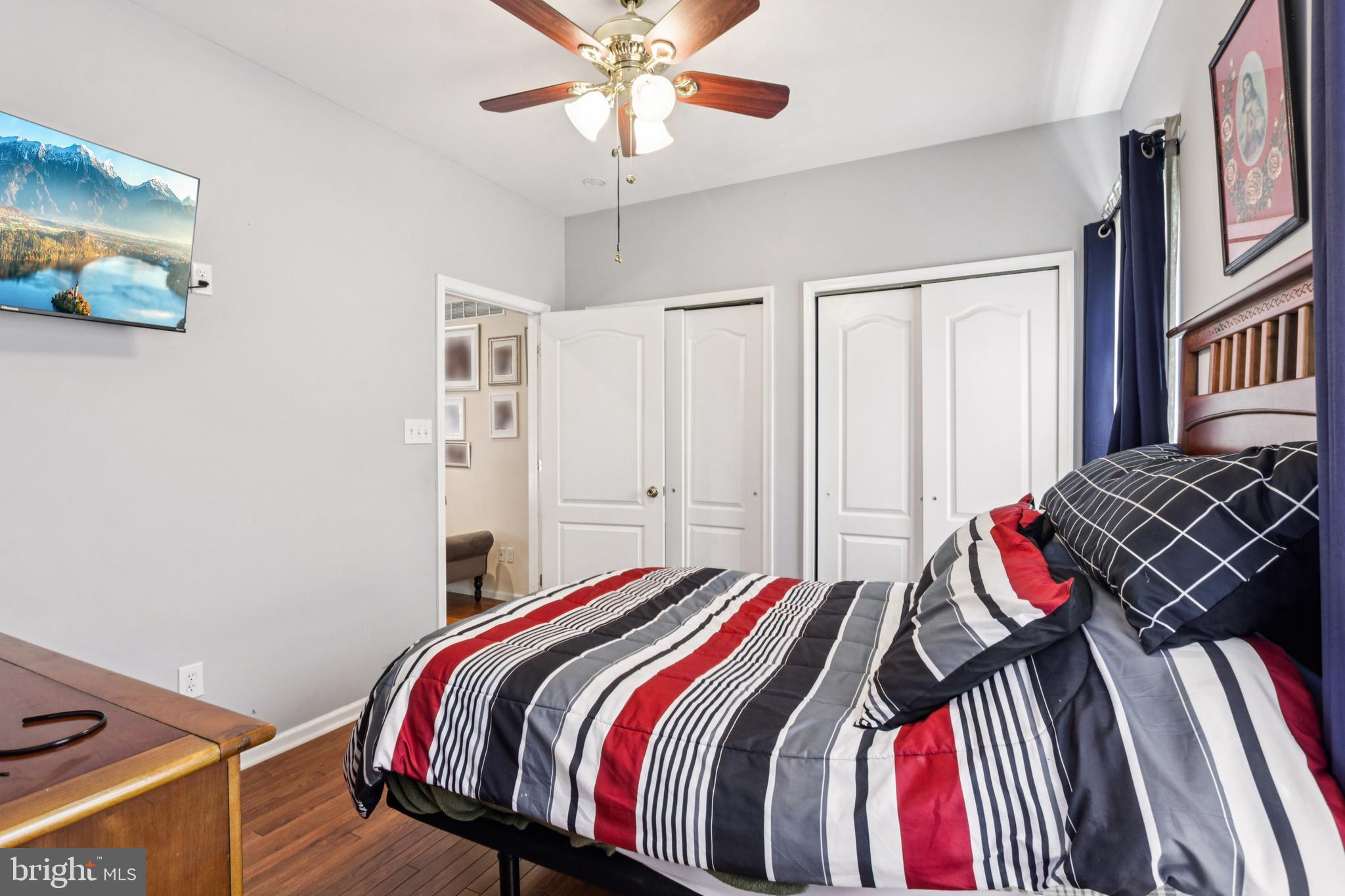 104 Ryans Run Sicklerville, NJ 08081 - Photo 33 of 94 a bedroom with a bed and a chandelier