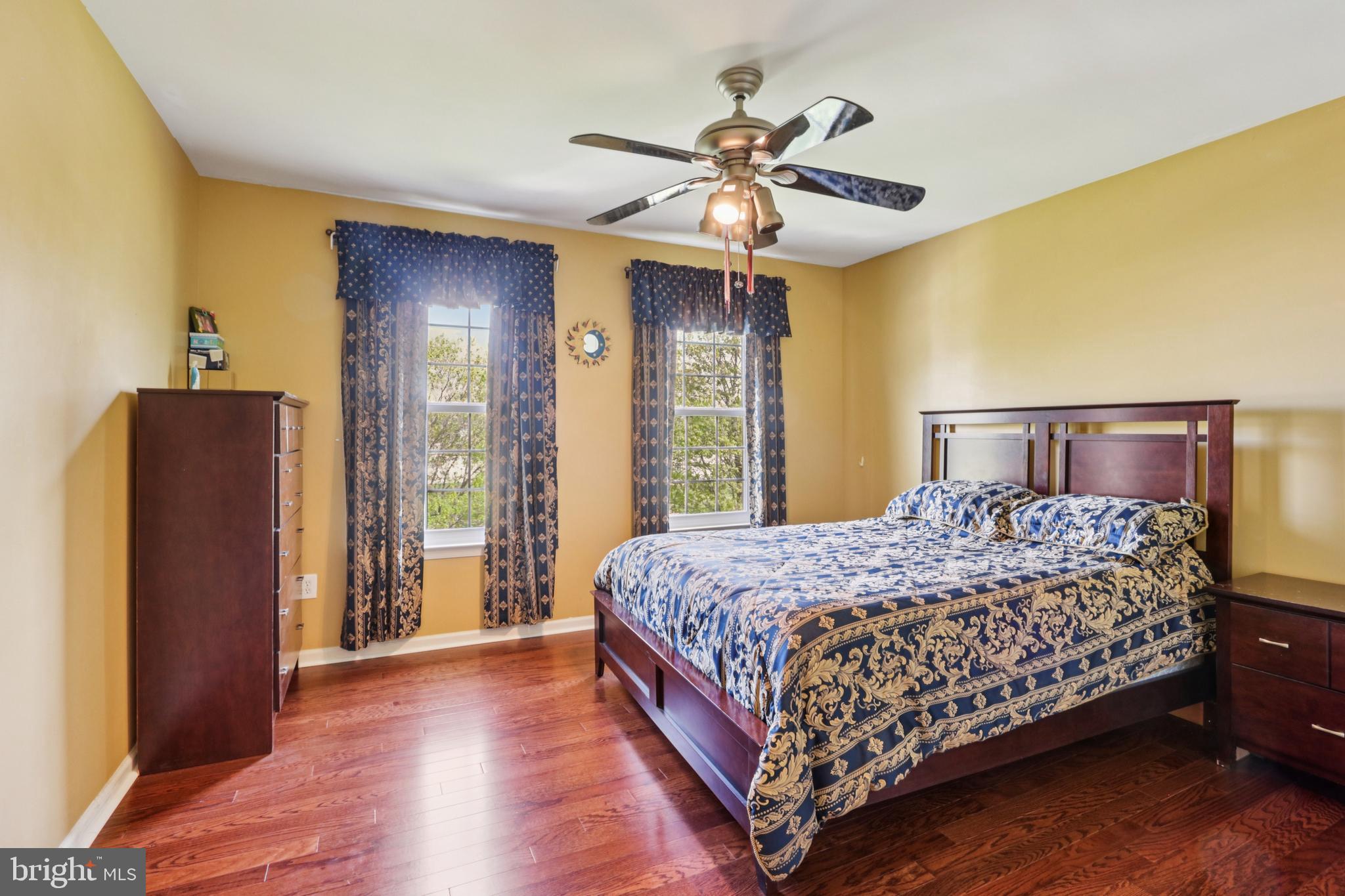 104 Ryans Run Sicklerville, NJ 08081 - Photo 40 of 94 a bedroom with a large bed and a chandelier