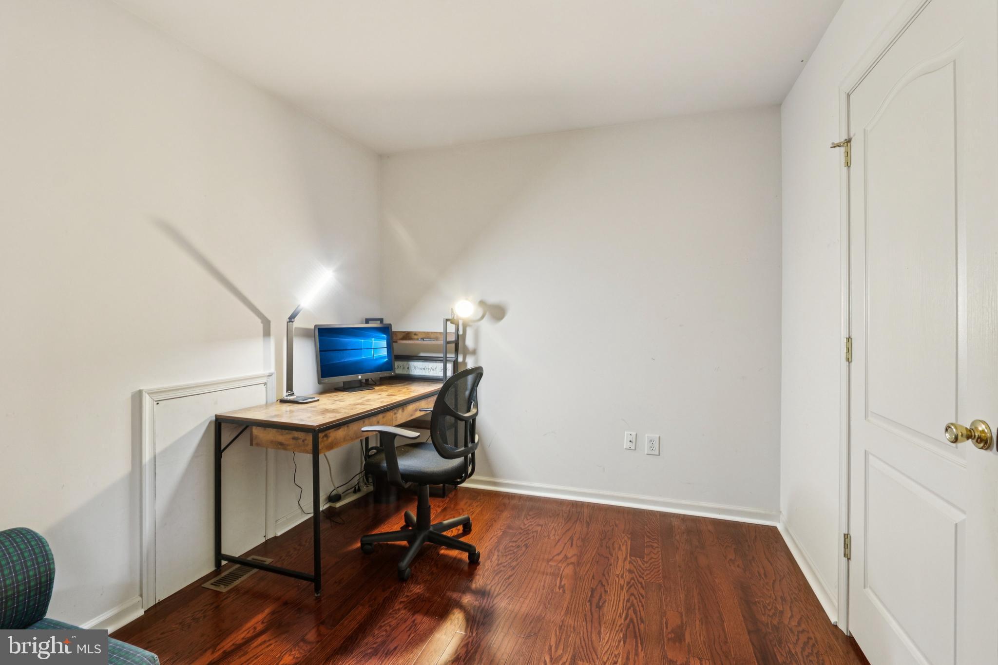 104 Ryans Run Sicklerville, NJ 08081 - Photo 53 of 94 a view of workspace with wooden floor and lounge chair