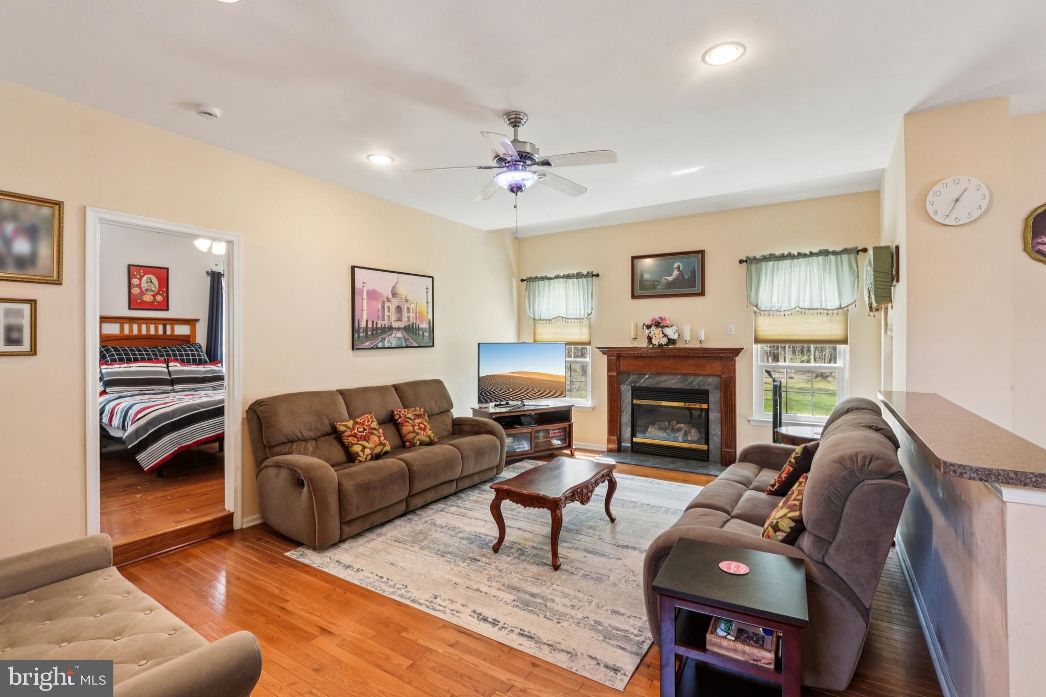 104 Ryans Run Sicklerville, NJ 08081 - Photo 6 of 94 a living room with furniture a fireplace and a window