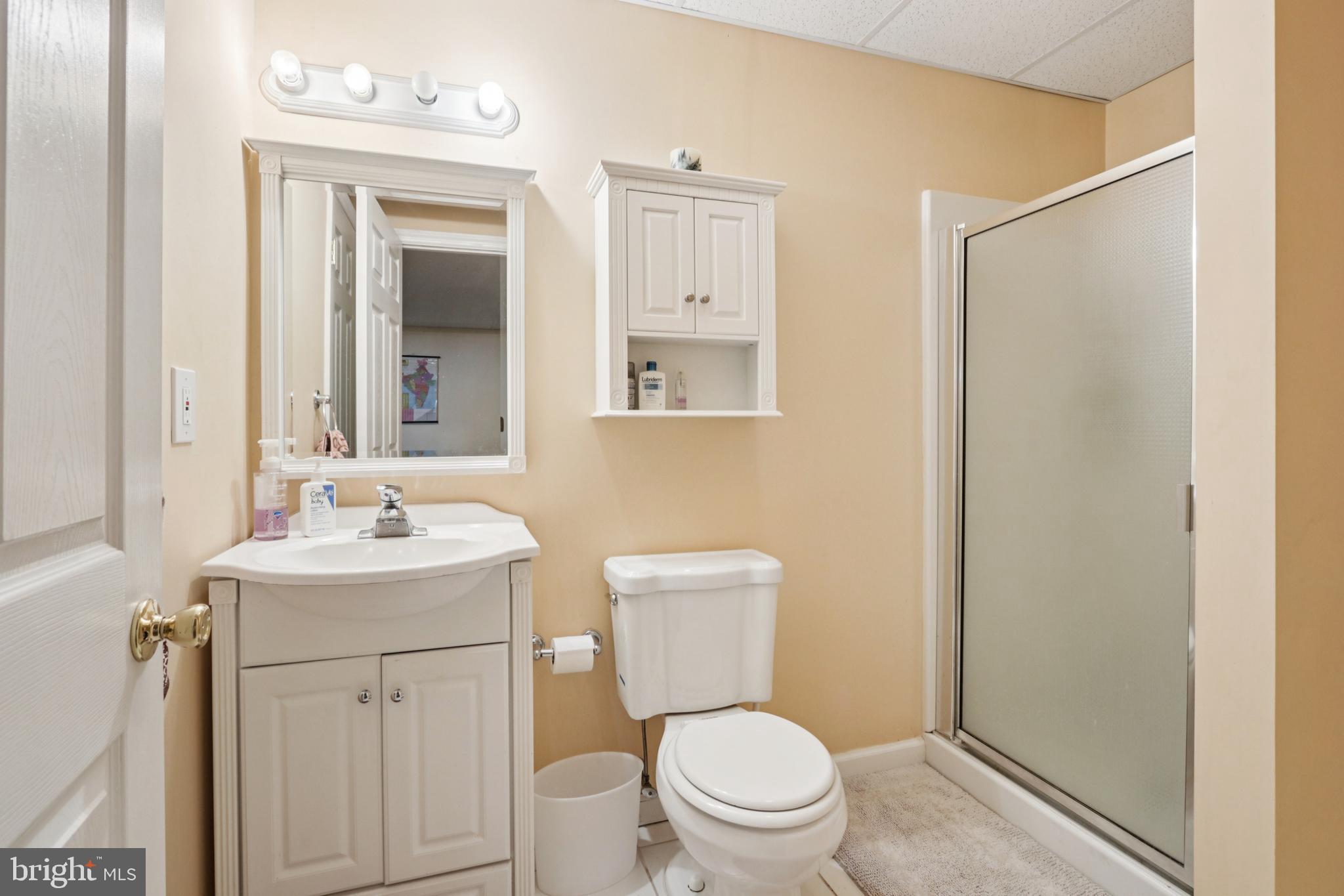 104 Ryans Run Sicklerville, NJ 08081 - Photo 65 of 94 a bathroom with a toilet a sink a mirror and vanity