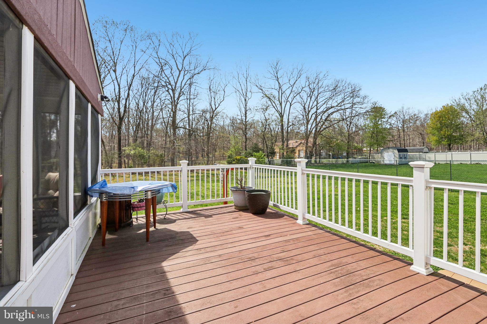 104 Ryans Run Sicklerville, NJ 08081 - Photo 73 of 94 a view of a deck with wooden floor and fence with a bench
