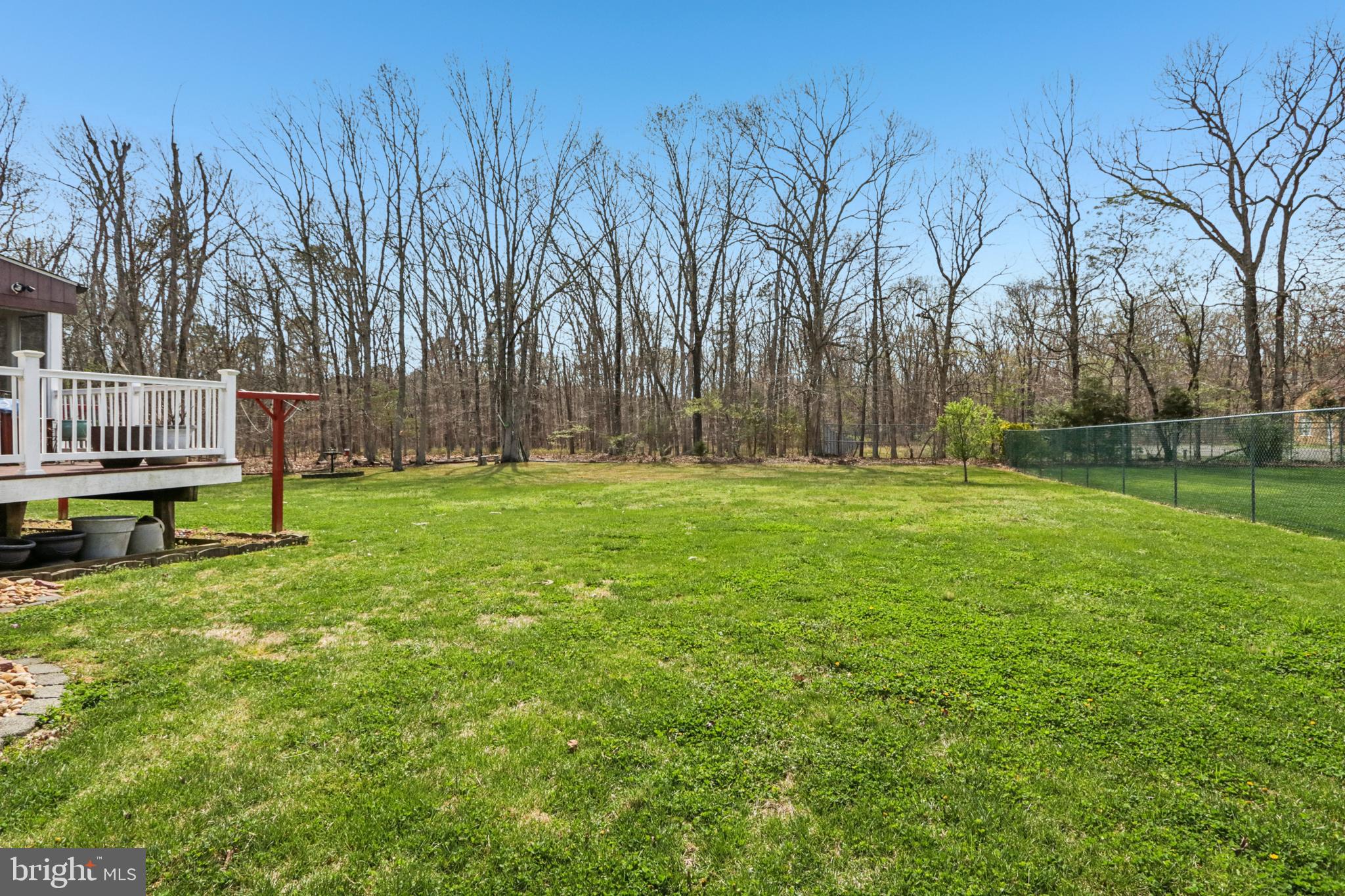 104 Ryans Run Sicklerville, NJ 08081 - Photo 75 of 94 a backyard of a house with lots of green space and trampoline