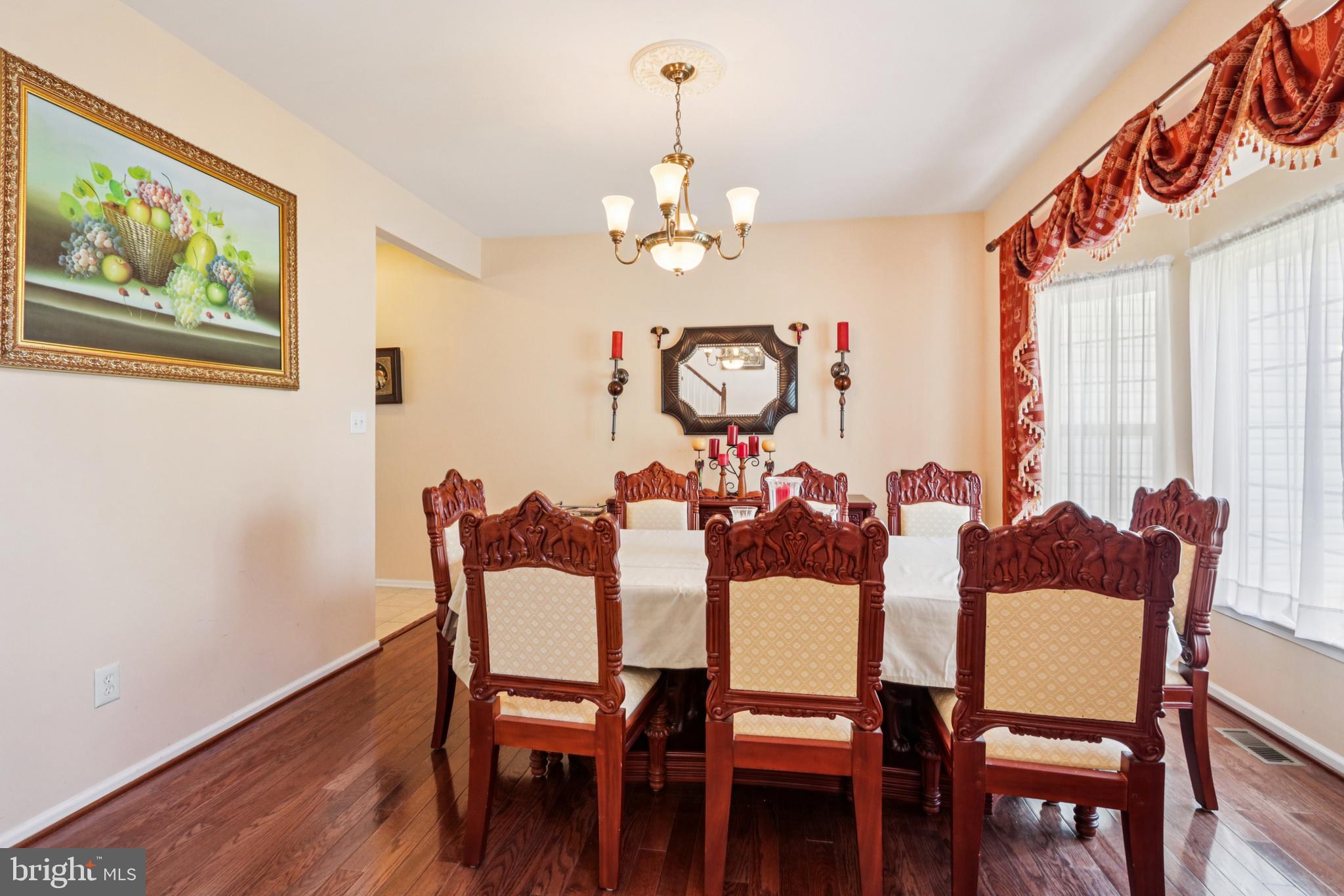104 Ryans Run Sicklerville, NJ 08081 - Photo 10 of 94 a view of a dining room with furniture wooden floor and a chandelier