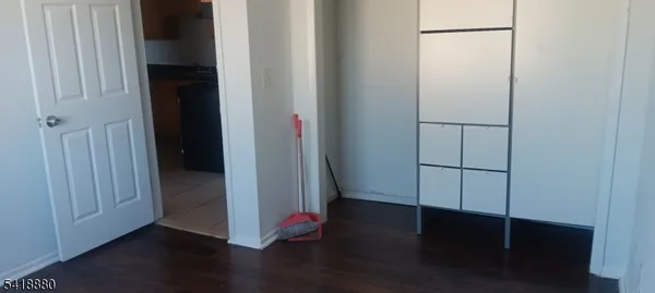 an empty room with wooden floor