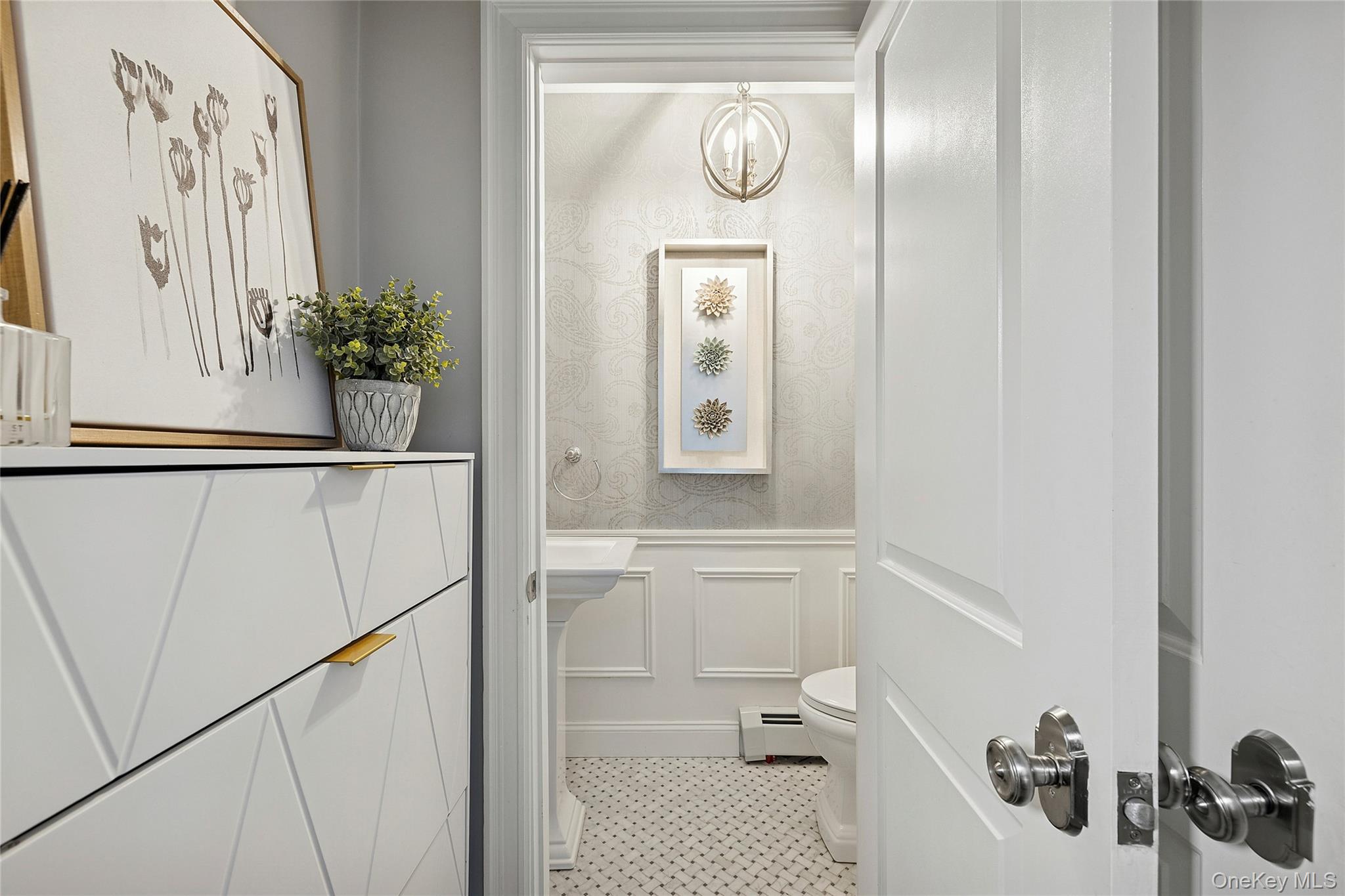 44 Old Ox Road Manhasset, NY 11030 - Photo 11 of 23 a bathroom with a sink and mirror with toilet