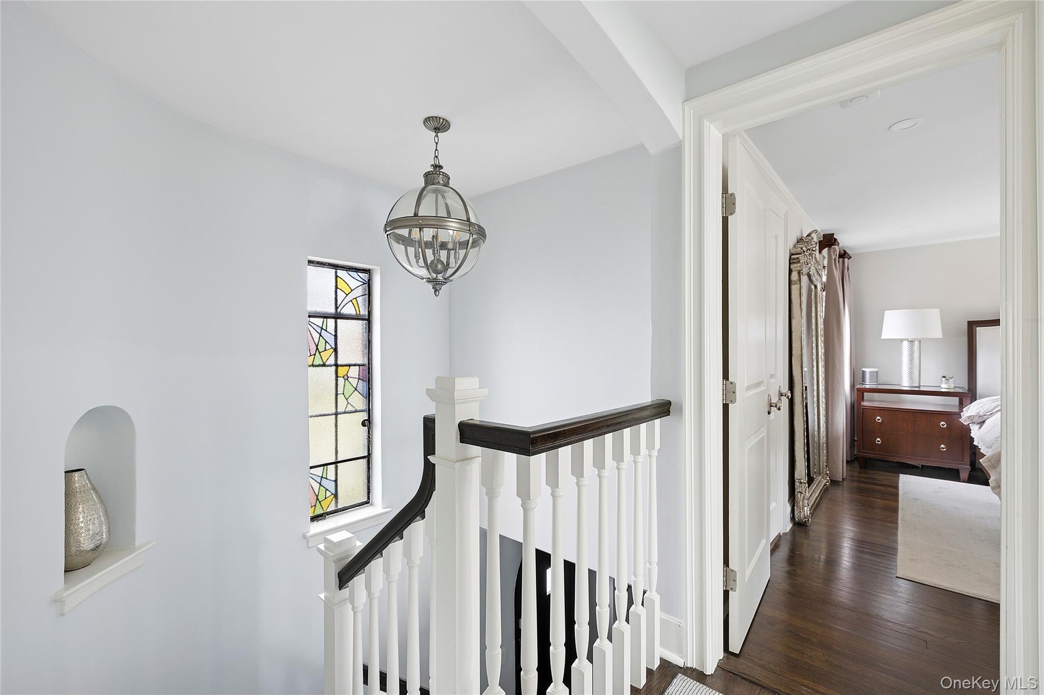 44 Old Ox Road Manhasset, NY 11030 - Photo 20 of 23 a view of entryway with wooden floor and stairs
