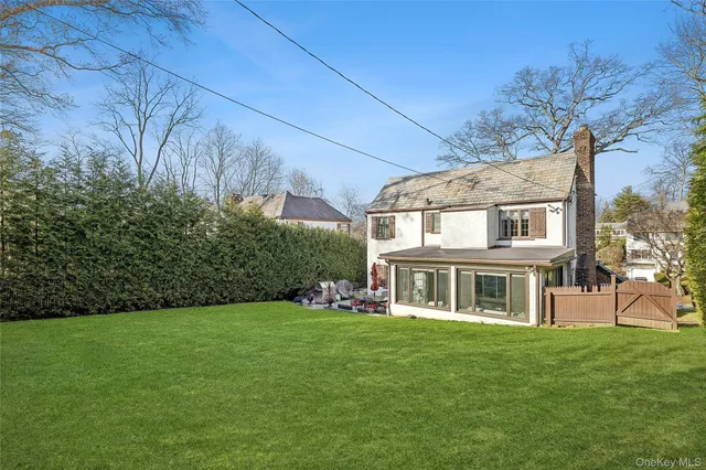 a view of an apartment with a backyard