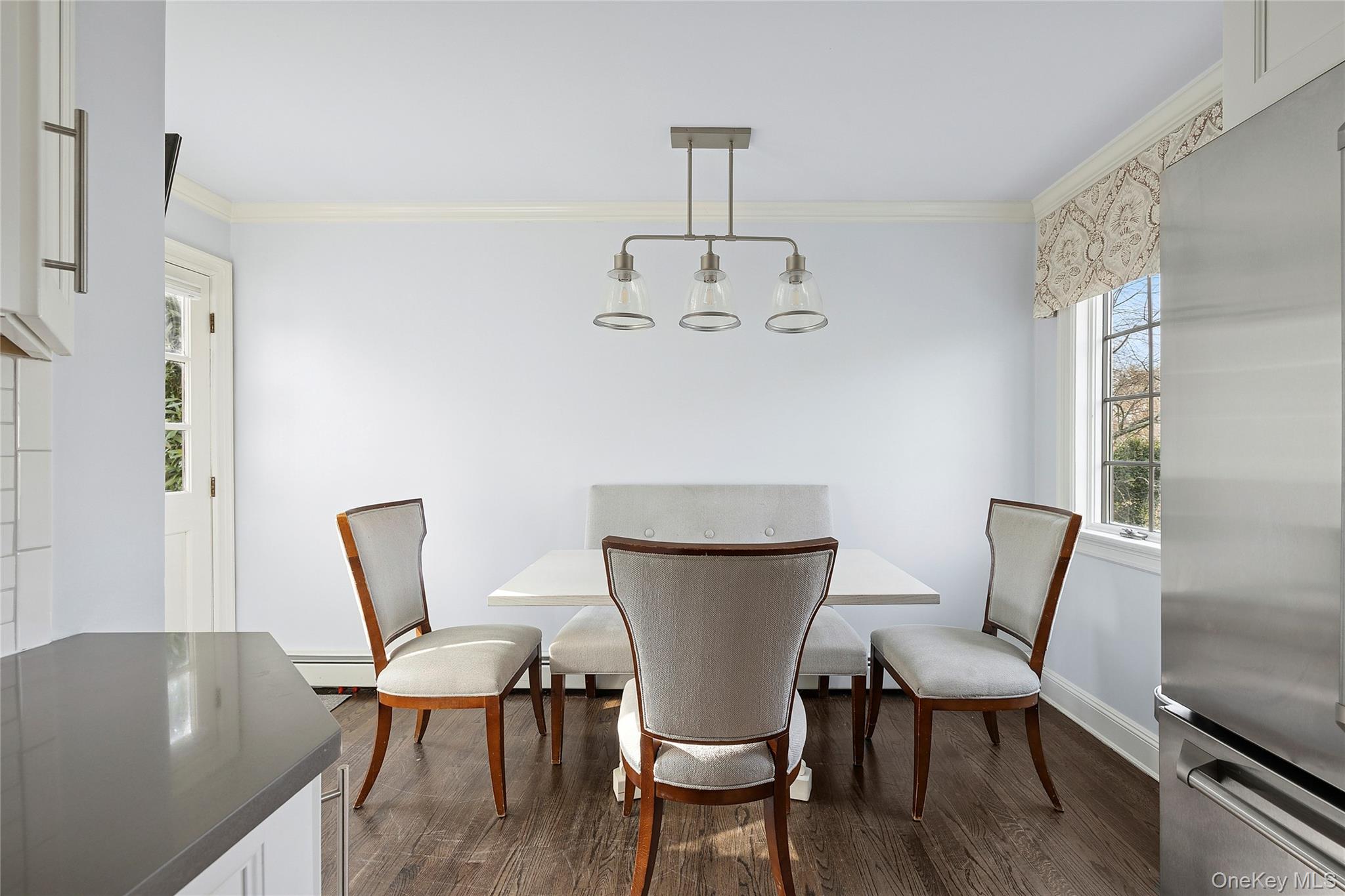 44 Old Ox Road Manhasset, NY 11030 - Photo 8 of 23 a view of a dining room with furniture and wooden floor