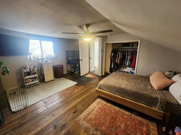 a bed room with a bed and a chandelier