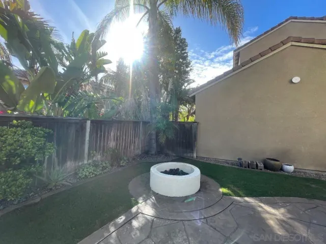 a view of a backyard of a house