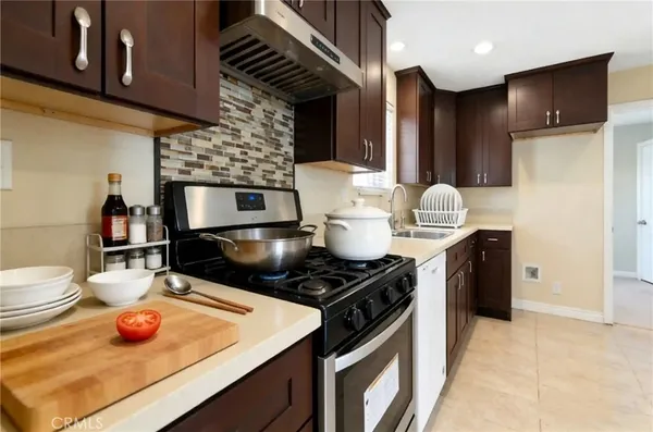 a kitchen with a stove and a microwave