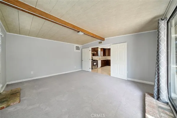 a view of an empty room with a fireplace