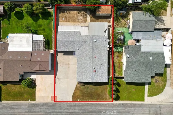 an aerial view of a house with a swimming pool
