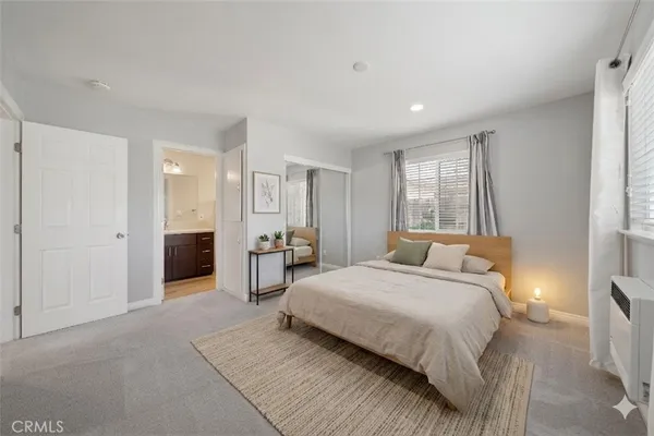 a bedroom with a bed and furniture