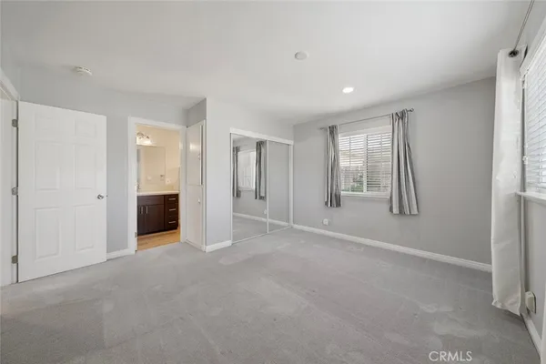 a view of an empty room with a bathroom