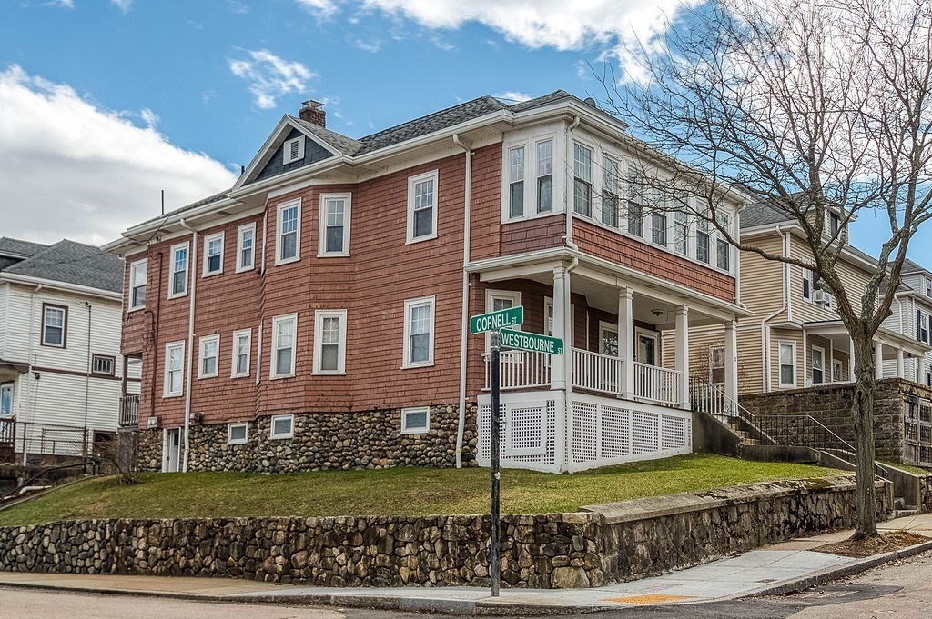 73 Westbourne Street Boston, MA 02131 - Photo 1 of 41 a front view of a house with a yard