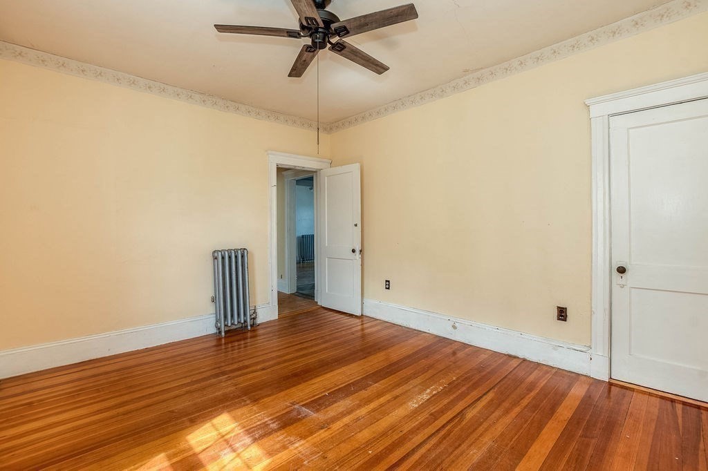 73 Westbourne Street Boston, MA 02131 - Photo 13 of 41 a view of a room with wooden floor and ceiling fan